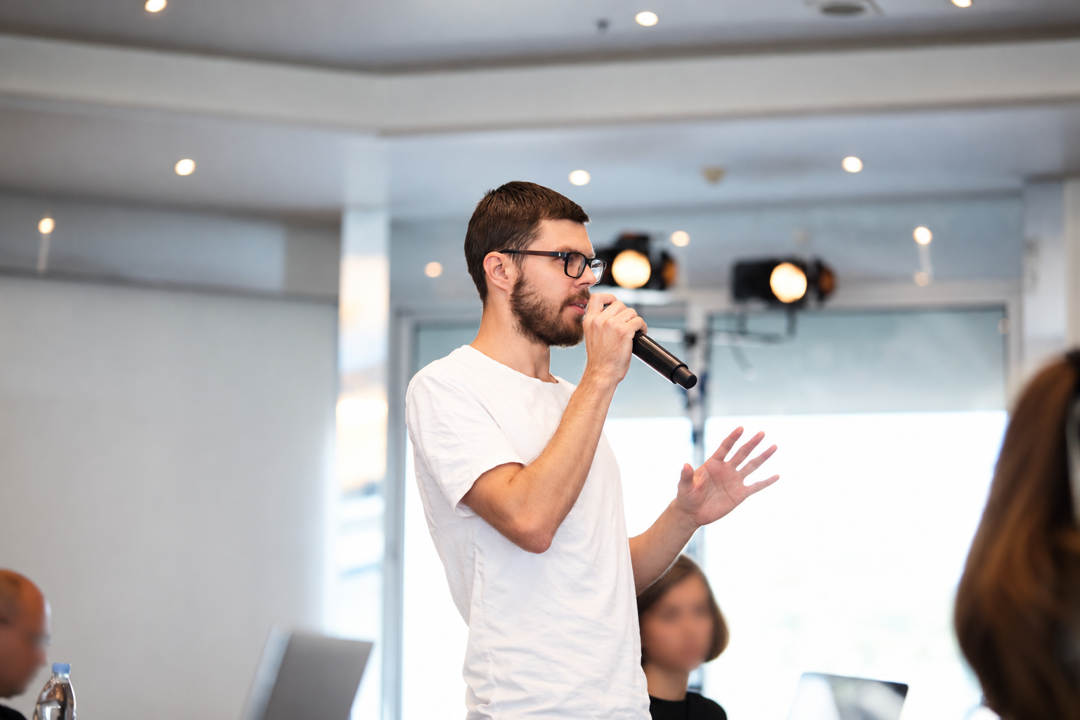 Tony Jacobs leading a session in a modern conference room